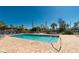 Community pool with plenty of lounge chairs for relaxation at 502 Pine Hollow Cir # 502, Englewood, FL 34223