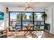 Peaceful screened balcony overlooking a canal with seating for two at 502 Pine Hollow Cir # 502, Englewood, FL 34223