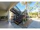 Exterior stairs leading to condo, near a shed at 502 Pine Hollow Cir # 502, Englewood, FL 34223