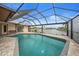 Relaxing pool area with screened enclosure and canal views at 634 Via Tunis, Punta Gorda, FL 33950