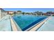 Community pool with lounge chairs at 66 Boundary Blvd # 271, Rotonda West, FL 33947