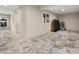 Spacious basement area with tile flooring and access to a spiral staircase at 710 Albee W Rd, Nokomis, FL 34275