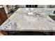 Close-up of the kitchen island, highlighting the unique stone countertop at 710 Albee W Rd, Nokomis, FL 34275
