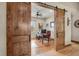 View of home office through sliding barn doors, featuring hardwood floors and a ceiling fan at 710 Albee W Rd, Nokomis, FL 34275