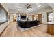 Spacious living room boasts hardwood floors, a coffered ceiling and sliding barn doors at 710 Albee W Rd, Nokomis, FL 34275