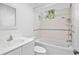 Bathroom with bathtub, tiled walls, and white vanity at 7147 Lago St, Sarasota, FL 34241