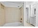 Bathroom with shower/tub combo and tiled walls at 7147 Lago St, Sarasota, FL 34241
