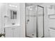 Bathroom with shower stall, tiled walls, and white vanity at 7147 Lago St, Sarasota, FL 34241