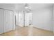Bedroom with light wood flooring and double closets at 7147 Lago St, Sarasota, FL 34241