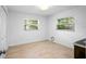 Spacious bedroom with light flooring and two large windows at 7147 Lago St, Sarasota, FL 34241