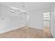 Spacious bedroom with light wood flooring and built-in shelving at 7147 Lago St, Sarasota, FL 34241