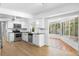 Modern kitchen with white cabinets, granite countertops and breakfast nook at 7147 Lago St, Sarasota, FL 34241