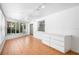 Sunroom with terracotta tile floor and view of backyard at 7147 Lago St, Sarasota, FL 34241