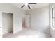 Bright bedroom features light wood floors, neutral paint, ceiling fan, a closet and large window at 7330 Printer St, Port Charlotte, FL 33981