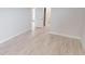 Bright bedroom features light wood floors, white trim, and neutral paint at 7330 Printer St, Port Charlotte, FL 33981
