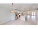 Open-concept kitchen featuring a large island, stainless steel appliances, and seamless flow to living space at 7330 Printer St, Port Charlotte, FL 33981