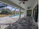 A screened in patio includes a pool and a lounging area at 7330 Printer St, Port Charlotte, FL 33981