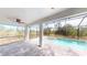 An outdoor patio includes a pool and a screened in lanai at 7330 Printer St, Port Charlotte, FL 33981