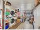 Functional laundry room with shelving, storage space, and a washing machine and dryer at 735 Summersea Ct, Englewood, FL 34223