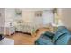 Comfortable bedroom with a queen bed, side tables, and bright lighting at 735 Summersea Ct, Englewood, FL 34223