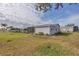 Charming single-story home featuring a well-maintained lawn and a lovely screened-in porch at 735 Summersea Ct, Englewood, FL 34223