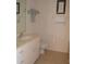 Clean bathroom with white vanity, toilet, and shower at 8100 Memory Ln # 207, Rotonda West, FL 33947