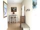 Small dining area with table and chairs near entryway at 8100 Memory Ln # 207, Rotonda West, FL 33947
