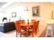 Dining room with a wooden table and six chairs at 8100 Memory Ln # 207, Rotonda West, FL 33947