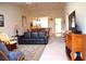 Open living room showcasing a view into the dining area and kitchen at 8100 Memory Ln # 207, Rotonda West, FL 33947