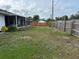 Large backyard with a wooden fence and plenty of space at 872 Dobell Nw Ter, Port Charlotte, FL 33948