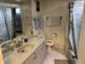 Bathroom with a tub, toilet and vanity at 872 Dobell Nw Ter, Port Charlotte, FL 33948