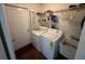 Laundry room with washer, dryer, and utility sink at 872 Dobell Nw Ter, Port Charlotte, FL 33948