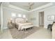 Main bedroom with king bed and access to another room at 10958 Trevino St, Englewood, FL 34223
