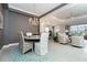 Open concept dining room with view into Gathering room and kitchen at 10958 Trevino St, Englewood, FL 34223