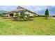 Single-Gathering home with manicured lawn and landscaping at 10958 Trevino St, Englewood, FL 34223