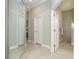 Elegant hallway with a large mirror and neutral color palette at 10958 Trevino St, Englewood, FL 34223
