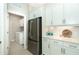 Convenient laundry room with washer, dryer, and extra storage at 10958 Trevino St, Englewood, FL 34223
