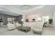 Open concept living room with access to kitchen and dining area at 10958 Trevino St, Englewood, FL 34223