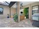 Covered patio with wicker furniture and a view of the pool at 10958 Trevino St, Englewood, FL 34223