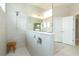 Walk-in shower with neutral tile and glass enclosure at 10958 Trevino St, Englewood, FL 34223