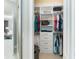 Well-organized walk-in closet with custom shelving at 10958 Trevino St, Englewood, FL 34223