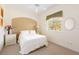 A clean bedroom featuring neutral walls, carpet, and white furniture at 110 Barracuda Dr, Placida, FL 33946