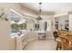 Kitchen with a unique window overlooking the pool area, offering a bright and open feel at 110 Barracuda Dr, Placida, FL 33946