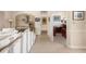 Comfortable living room featuring tile floors, neutral colors, and an open layout to other rooms at 110 Barracuda Dr, Placida, FL 33946