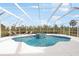 Beautiful in-ground pool and spa enclosed by a screen with outdoor lounge furniture at 110 Barracuda Dr, Placida, FL 33946