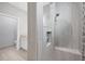 Walk in shower with tile surround and a built in niche at 119 White Pine Dr, Rotonda West, FL 33947