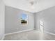 Cozy bedroom with a ceiling fan and a window at 119 White Pine Dr, Rotonda West, FL 33947