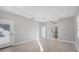 Spacious bedroom with a tray ceiling and access to a walk in closet at 119 White Pine Dr, Rotonda West, FL 33947