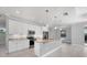 Modern kitchen with stainless steel appliances, a large island, and marble countertops at 119 White Pine Dr, Rotonda West, FL 33947