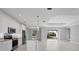 Modern kitchen with stainless steel appliances and a large island with granite countertops at 119 White Pine Dr, Rotonda West, FL 33947